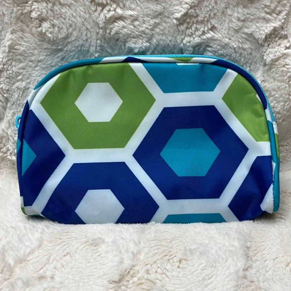 Small cosmetic bag with zip top closure.